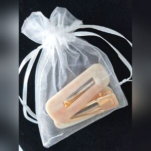 New never used gold and pink opalessant pair of hair clips